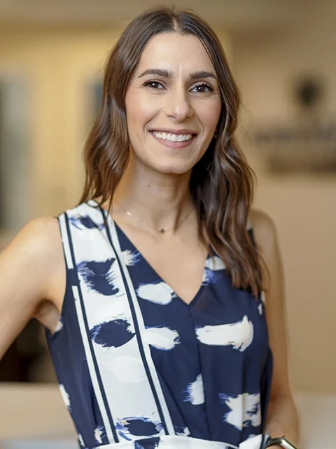 Dr. Kristen De Bonis, general dentist, smiling in the practice.