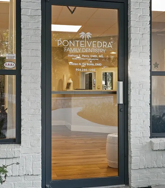 The glass front door, lettered with the practice name.
