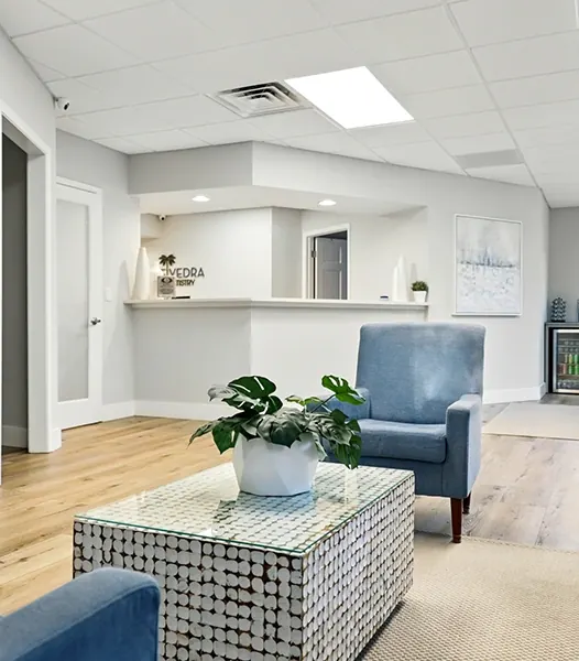 The waiting room, with armchairs and a sofa by the windows.